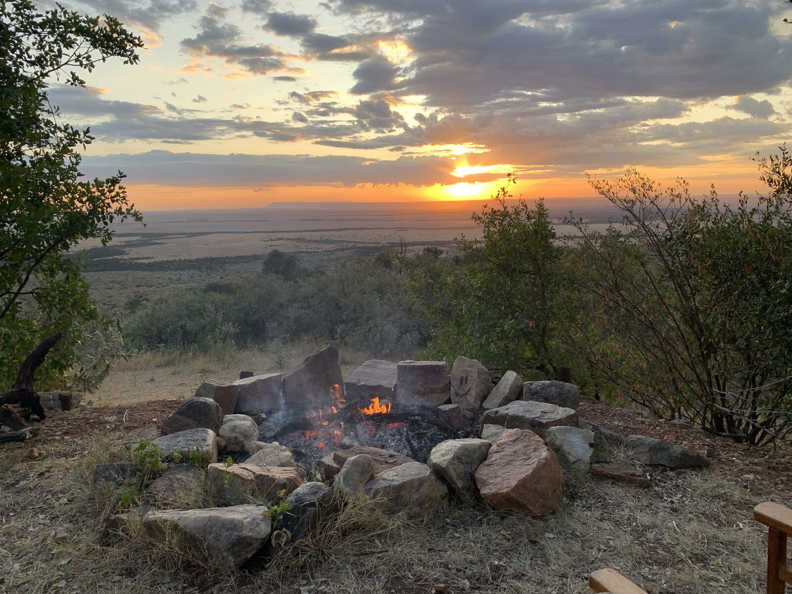 A campfire at sunset over the savannah